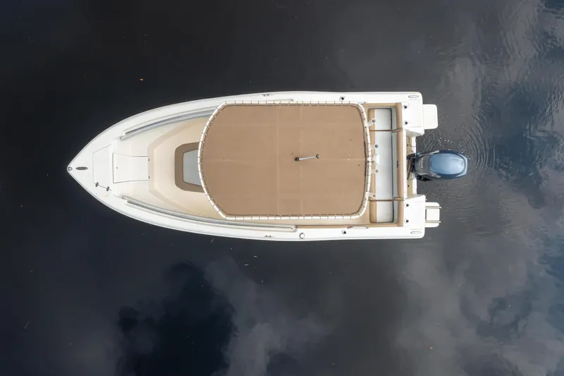 Slide: The Image of Overhead view of 2015 Scout 210 XSF boat on calm water. - 6