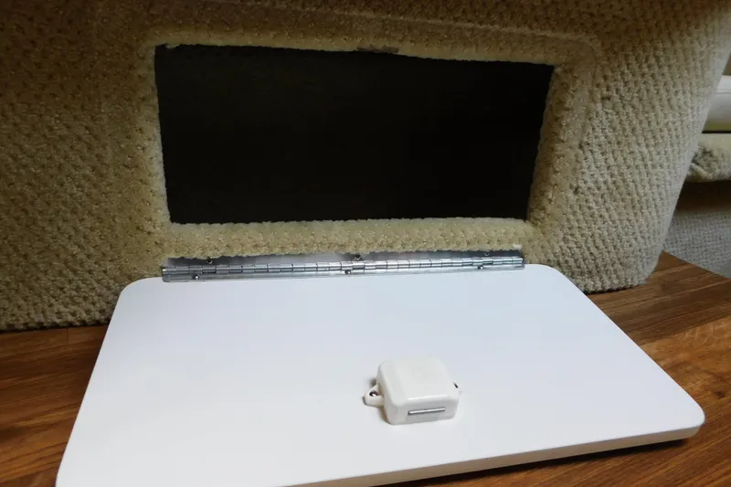 Slide: The Image of Hinged compartment door on 2005 Sea Ray 320 Sundancer boat interior. - 101