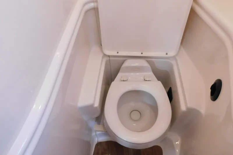 Slide: The Image of Toilet in 2005 Sea Ray 320 Sundancer boat bathroom, white interior. - 107