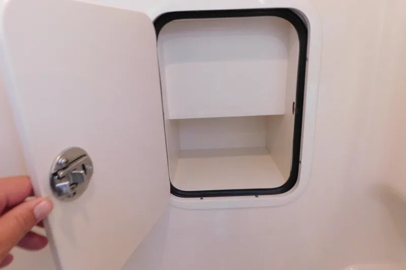 Slide: The Image of Open storage compartment on a 2005 Sea Ray 320 Sundancer boat. - 109