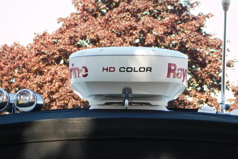 Slide: The Image of Radar equipment on 2005 Sea Ray 320 Sundancer boat with autumn foliage background. - 11