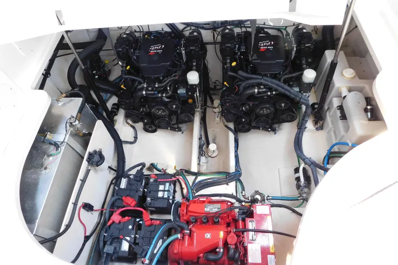 Slide: The Image of Engine compartment of 2005 Sea Ray 320 Sundancer with dual engines and battery setup. - 115