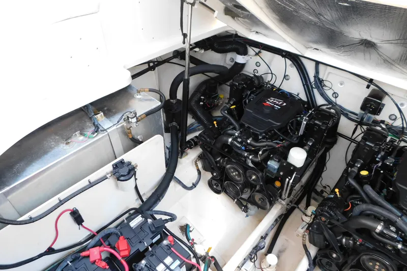 Slide: The Image of Engine compartment of a 2005 Sea Ray 320 Sundancer, showcasing dual engines and wiring. - 117