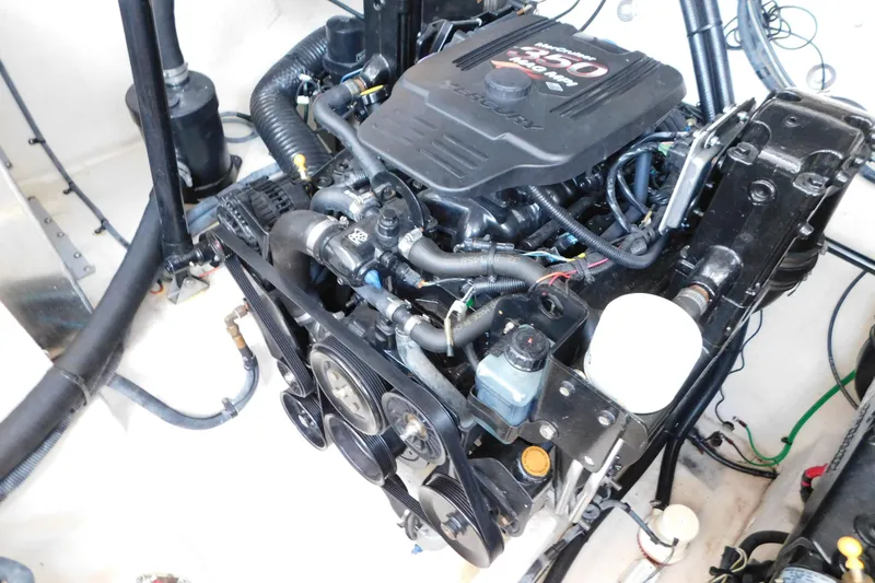 Slide: The Image of Engine compartment of a 2005 Sea Ray 320 Sundancer boat, featuring a Mercury engine. - 125