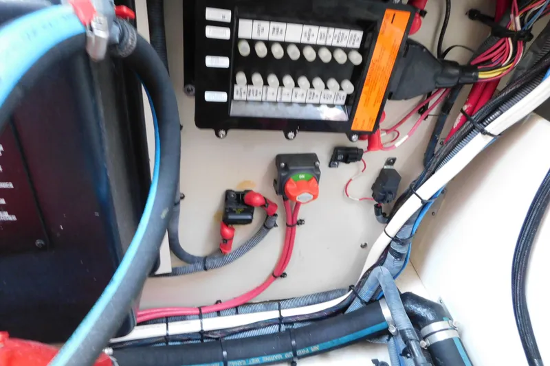 Slide: The Image of Electrical panel and wiring inside a 2005 Sea Ray 320 Sundancer boat. - 127