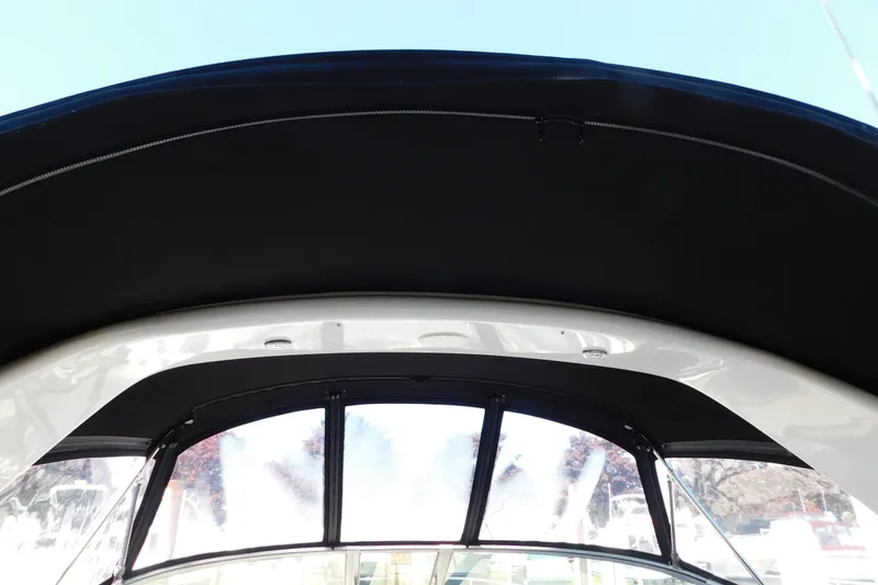 Slide: The Image of 2005 Sea Ray 320 Sundancer boat canopy and windshield view. - 15