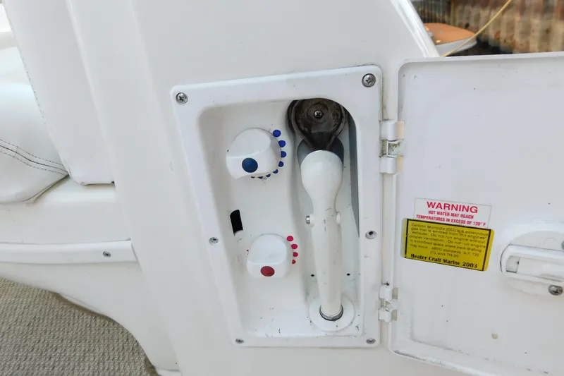 Slide: The Image of Control panel on a 2005 Sea Ray 320 Sundancer boat with temperature warning. - 23