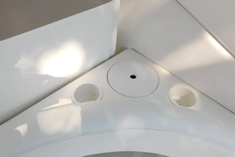 Slide: The Image of Interior detail of 2005 Sea Ray 320 Sundancer boat with cup holders and seating. - 27