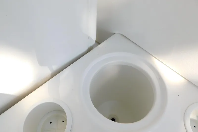 Slide: The Image of Cup holders on 2005 Sea Ray 320 Sundancer boat, white interior detail. - 28