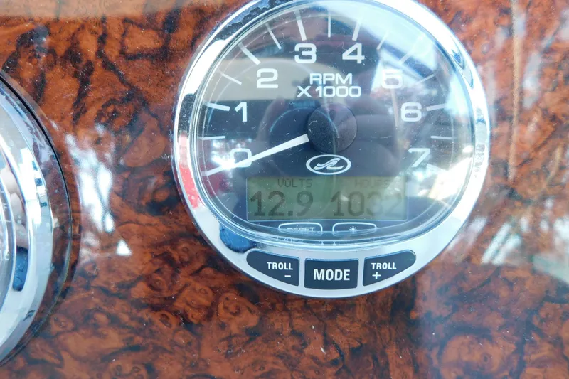Slide: The Image of Close-up of 2005 Sea Ray 320 Sundancer RPM gauge on wood grain dashboard. - 37