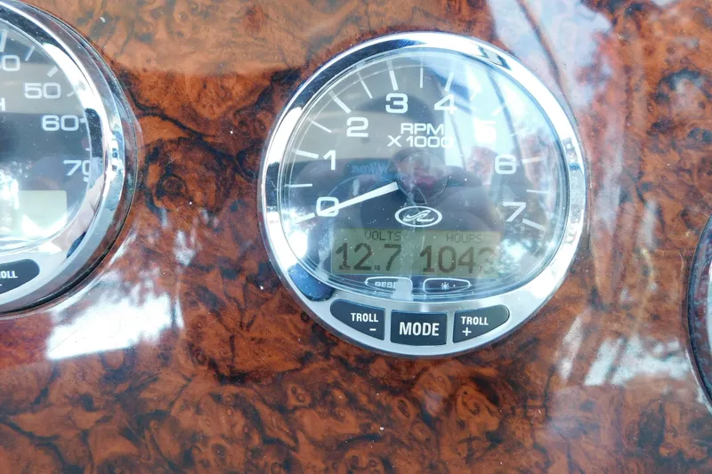 Slide: The Image of Close-up of 2005 Sea Ray 320 Sundancer RPM gauge on wood grain dashboard. - 38