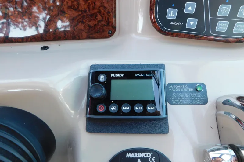 Slide: The Image of Control panel of a 2005 Sea Ray 320 Sundancer with Fusion MS-NRX300 and Halon system. - 39