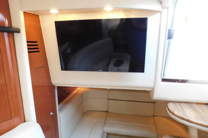 Slide: The Image of Interior of 2005 Sea Ray 320 Sundancer with TV and seating area. - 52