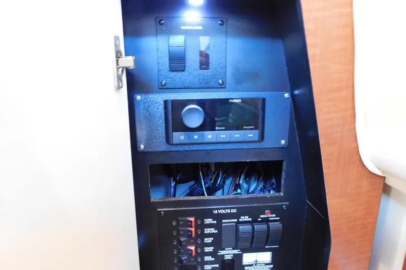 Slide: The Image of Electrical panel of 2005 Sea Ray 320 Sundancer boat with control switches and wiring. - 60