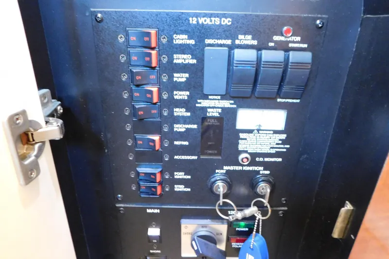 Slide: The Image of Electrical control panel of a 2005 Sea Ray 320 Sundancer boat. - 62