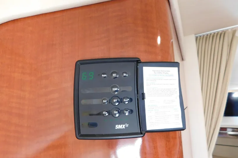 Slide: The Image of Thermostat control panel on 2005 Sea Ray 320 Sundancer yacht interior. - 73