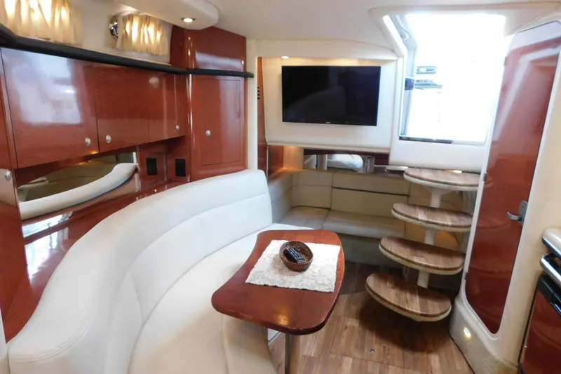 Slide: The Image of Luxurious interior of 2005 Sea Ray 320 Sundancer yacht with elegant seating and wooden finishes. - 75