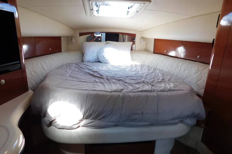 Slide: The Image of Luxurious cabin interior of 2005 Sea Ray 320 Sundancer with cozy bedding. - 76