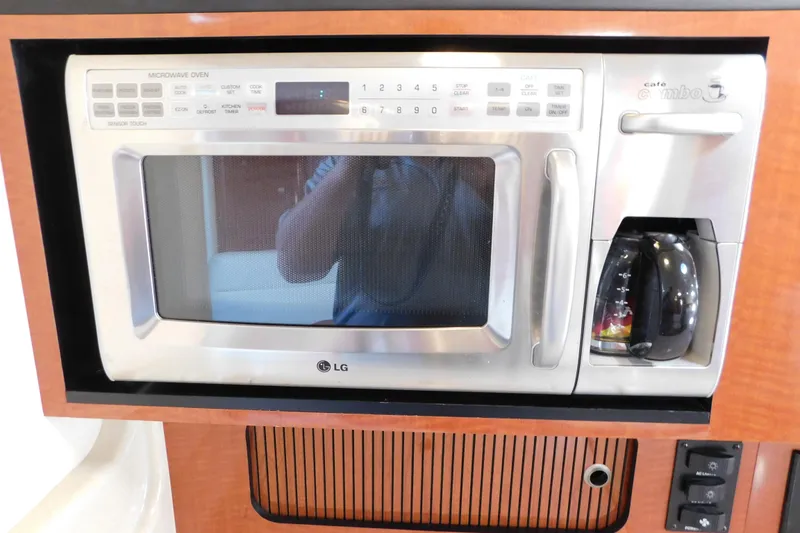 Slide: The Image of Built-in LG microwave and coffee maker on 2005 Sea Ray 320 Sundancer yacht. - 85