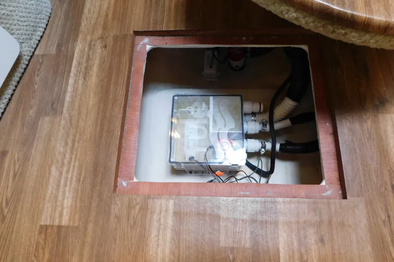 Slide: The Image of Access panel on 2005 Sea Ray 320 Sundancer boat, revealing electrical components. - 97