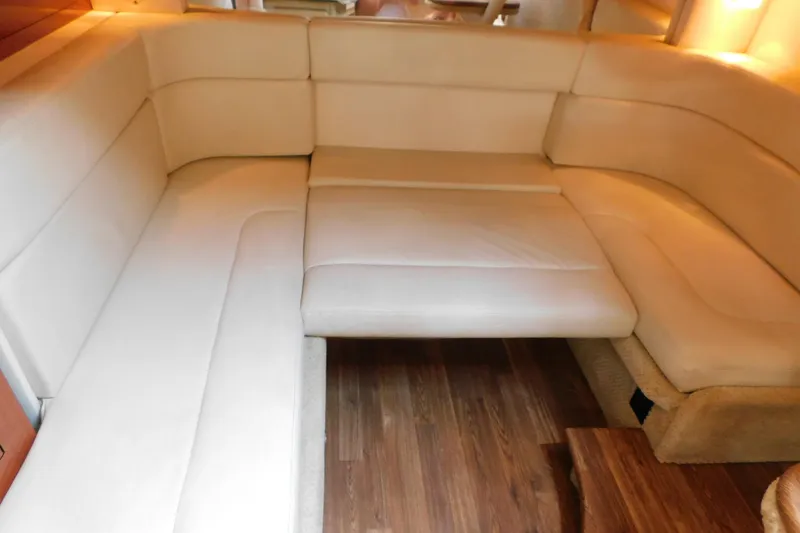 Slide: The Image of Luxurious beige seating area in 2005 Sea Ray 320 Sundancer yacht interior. - 98