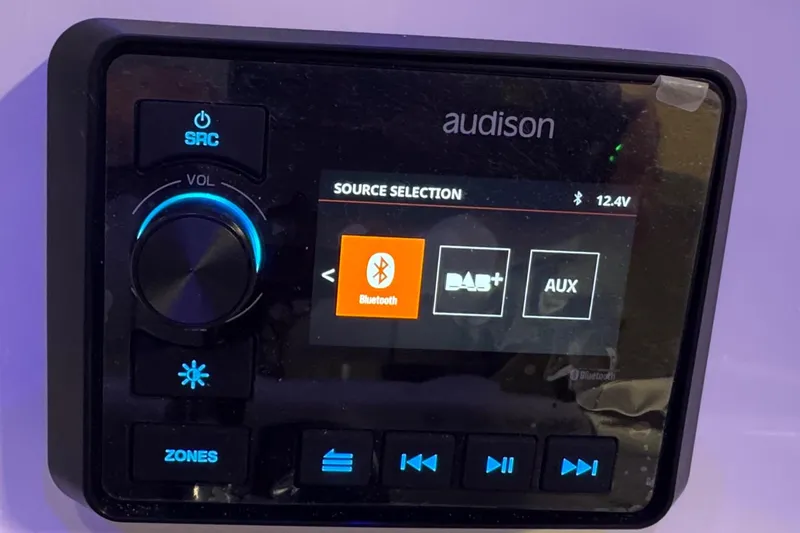 Slide: The Image of Audison audio control panel with Bluetooth, DAB+, AUX options on Sea Pro 222 Center Console 2026. - 12