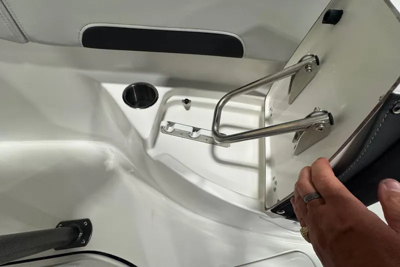 Slide: The Image of 2026 Sea Pro 222 Center Console boat interior with cup holder and handrail. - 21