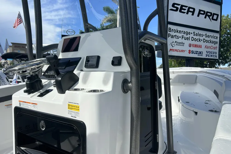 Slide: The Image of 2026 Sea Pro 222 Center Console boat interior with steering wheel and control panel. - 6
