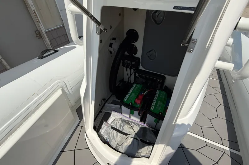 Slide: The Image of Interior view of 2025 Highfield Sport 560 boat showing battery compartment and storage area. - 10