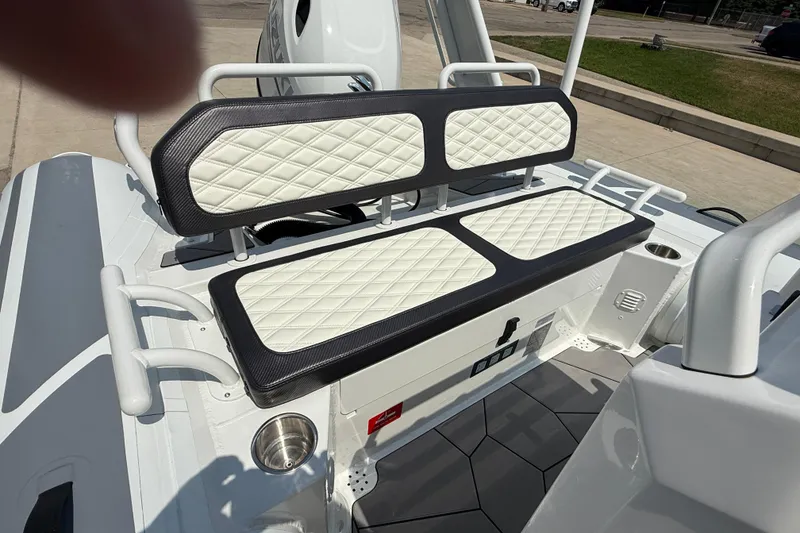 Slide: The Image of 2025 Highfield Sport 560 boat interior with diamond-stitched seating and modern design elements. - 19