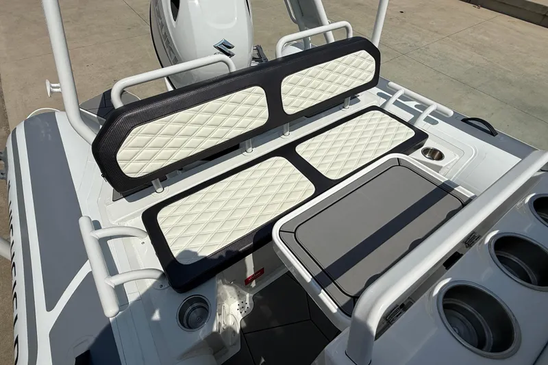 Slide: The Image of 2025 Highfield Sport 560 boat seating with diamond-stitched upholstery and storage compartments. - 20