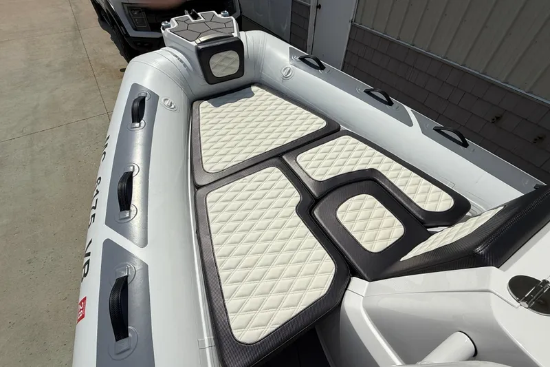 Slide: The Image of 2025 Highfield Sport 560 boat interior with quilted seating and sleek design. - 23