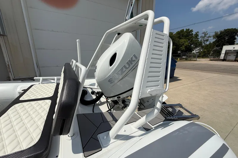 Slide: The Image of 2025 Highfield Sport 560 boat with Suzuki outboard motor, featuring sleek design and comfortable seating. - 25
