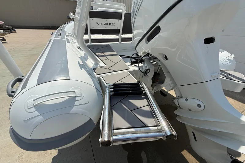 Slide: The Image of Highfield Sport 560 boat, 2025 model, featuring a sleek design and sturdy ladder. - 26