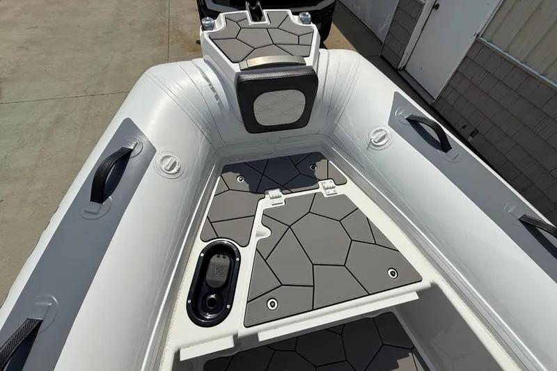 Slide: The Image of 2025 Highfield Sport 560 boat interior with modern design and geometric flooring. - 8