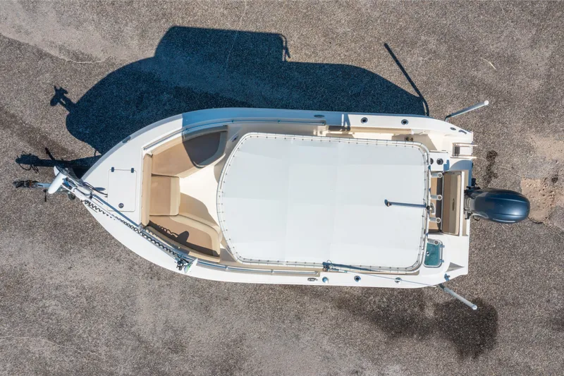 Slide: The Image of Overhead view of 2016 Cobia 201 Center Console boat on concrete surface. - 10