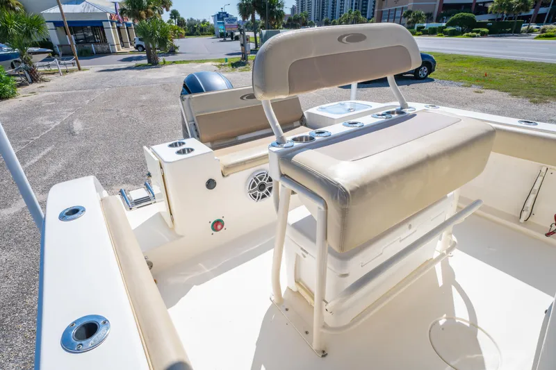 Slide: The Image of 2016 Cobia 201 Center Console boat interior with seating and storage. - 15
