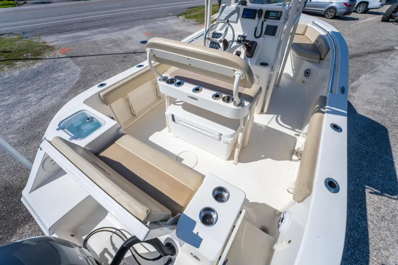 Slide: The Image of 2016 Cobia 201 Center Console boat interior with seating and control panel. - 17
