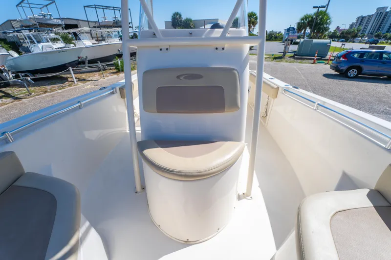 Slide: The Image of 2016 Cobia 201 Center Console boat interior with seating and storage. - 18