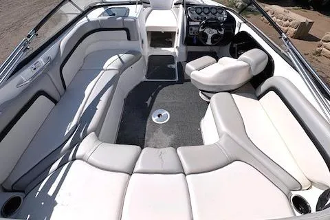 Slide: The Image of 2010 Yamaha Boats 212SS interior with spacious seating and modern dashboard design. - 21