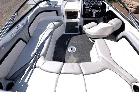 Slide: The Image of 2010 Yamaha Boats 212SS interior with spacious seating and modern dashboard. - 22