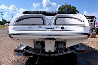 Slide: The Image of 2010 Yamaha Boats 212SS rear view on trailer, sunny day background. - 3