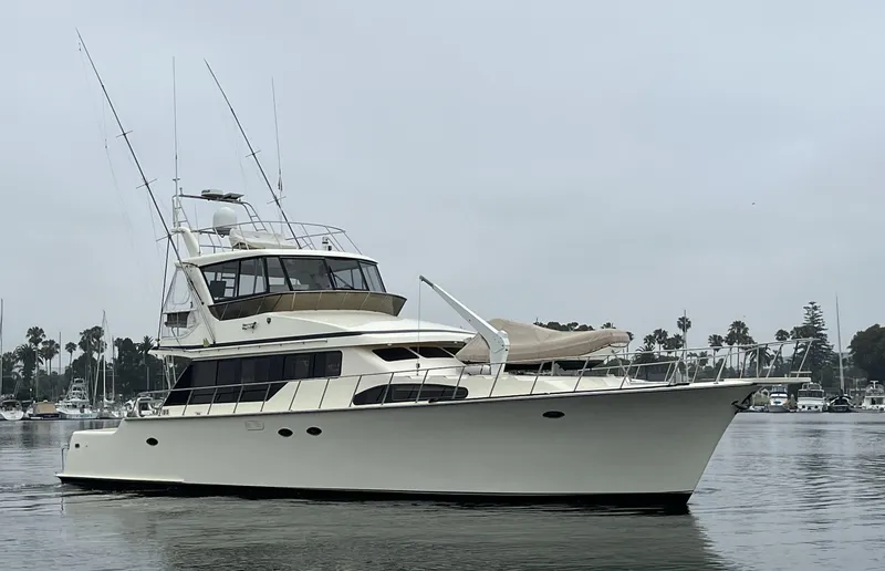 The Image of 1999 Mikelson Long-Range Luxury Sportfisher yacht on calm water, overcast sky. - 0