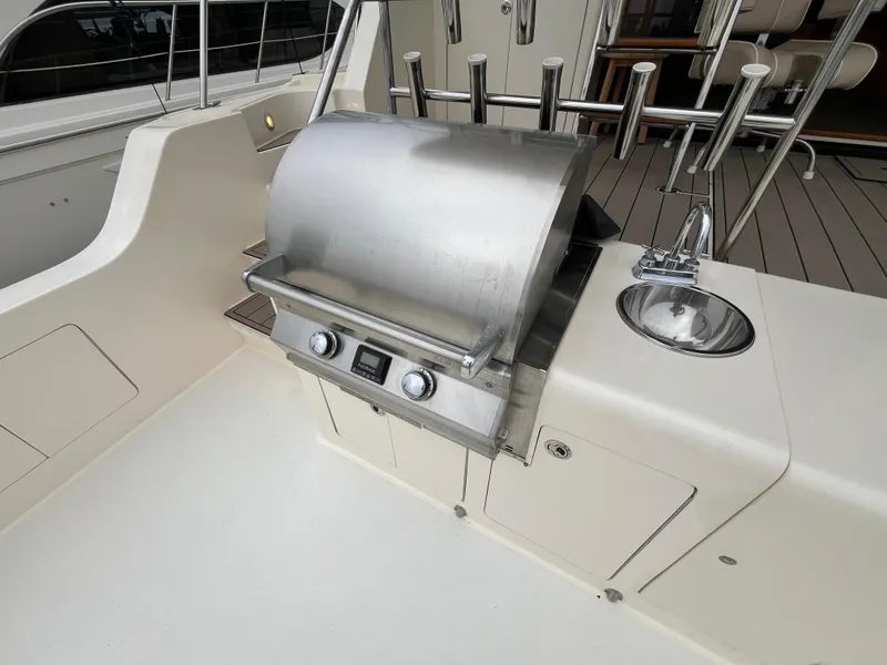 Slide: The Image of Outdoor grill and sink on 1999 Mikelson Long-Range Luxury Sportfisher yacht deck. - 11