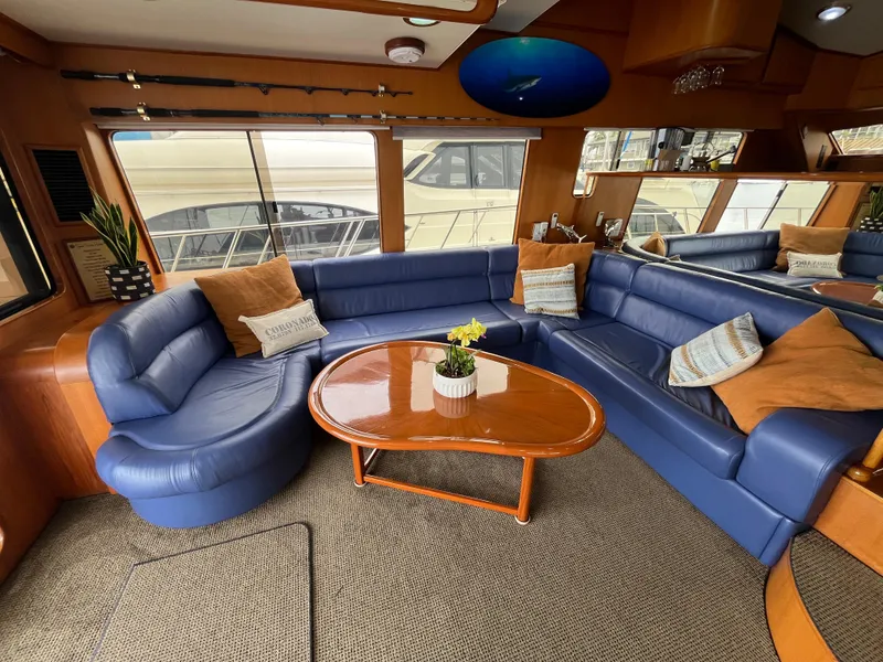 Slide: The Image of Luxurious interior of a 1999 Mikelson Long-Range Luxury Sportfisher with blue leather seating. - 21