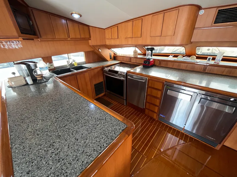 Slide: The Image of Luxurious kitchen interior of a 1999 Mikelson Long-Range Luxury Sportfisher yacht. - 26