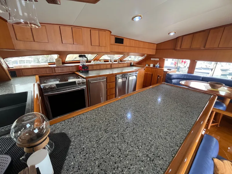 Slide: The Image of Luxurious kitchen interior of a 1999 Mikelson Long-Range Luxury Sportfisher yacht. - 28