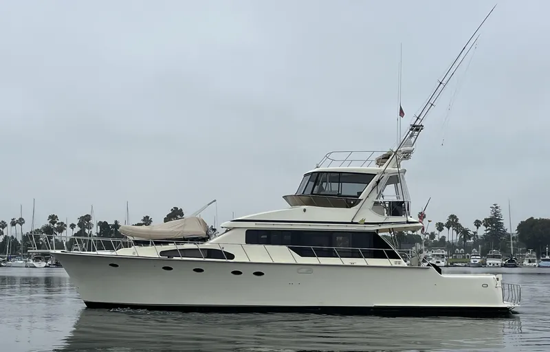 Slide: The Image of 1999 Mikelson Long-Range Luxury Sportfisher yacht on calm water, overcast sky. - 3
