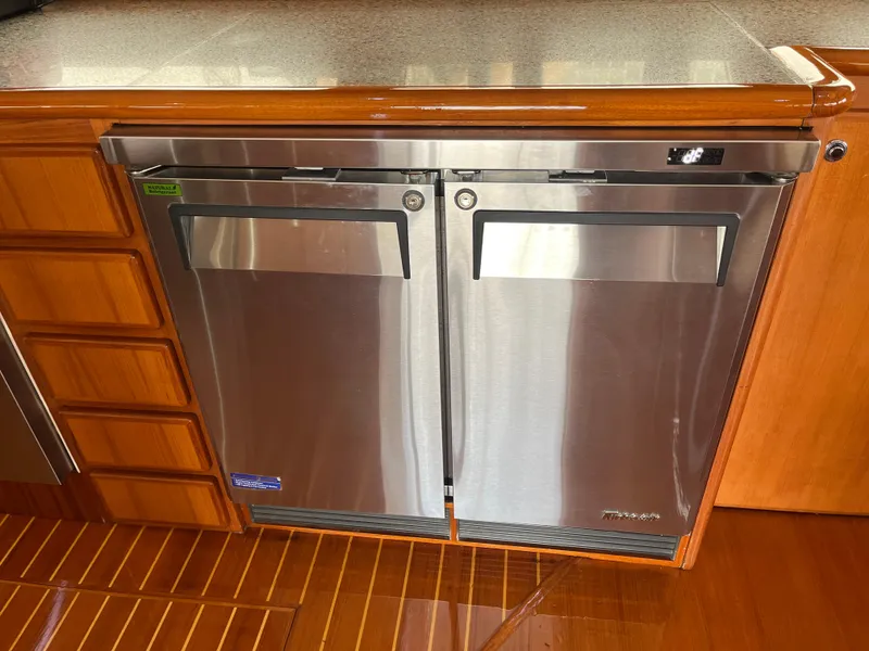 Slide: The Image of Stainless steel refrigerator in 1999 Mikelson Long-Range Luxury Sportfisher yacht kitchen. - 30