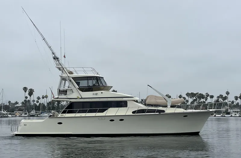 Slide: The Image of 1999 Mikelson Long-Range Luxury Sportfisher yacht on calm water, overcast sky. - 4